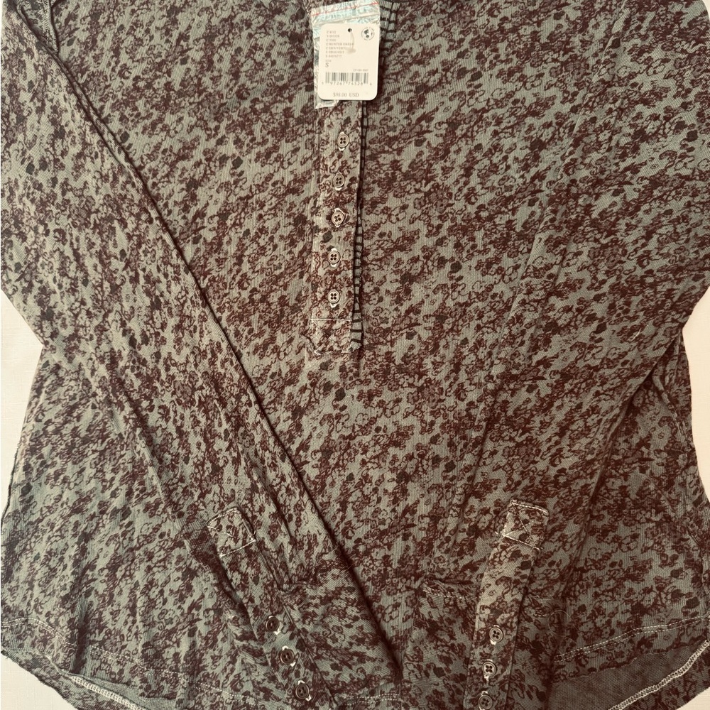 Free People long sleeve top in olive green with brown flower details.